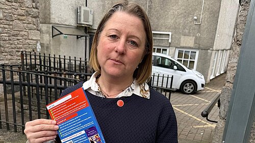 Libby wearing orange button